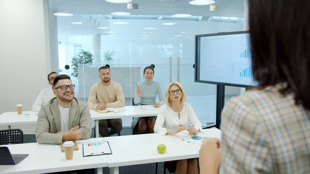 Diverse group of professionals rehearsing a press statement in a training room